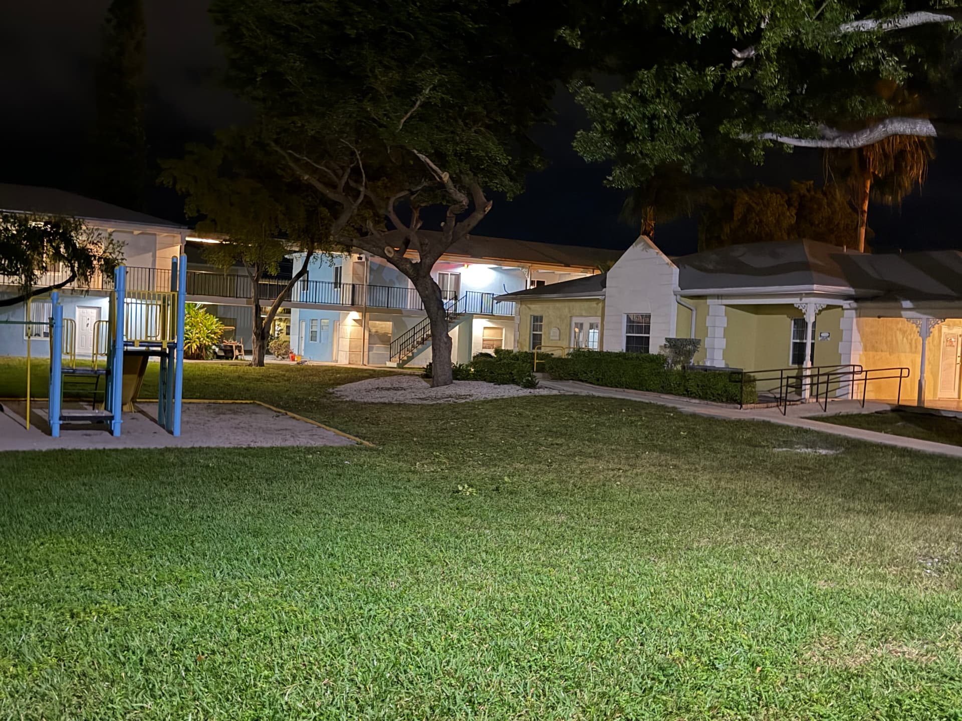 Apartment & Commercial Complex Maintenance — Apartment complex courtyard at night — Key West