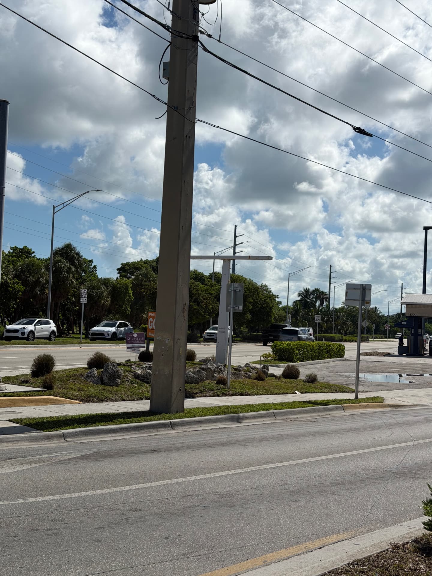 Exterior Property Care — Roadside median with rock and shrub plantings
