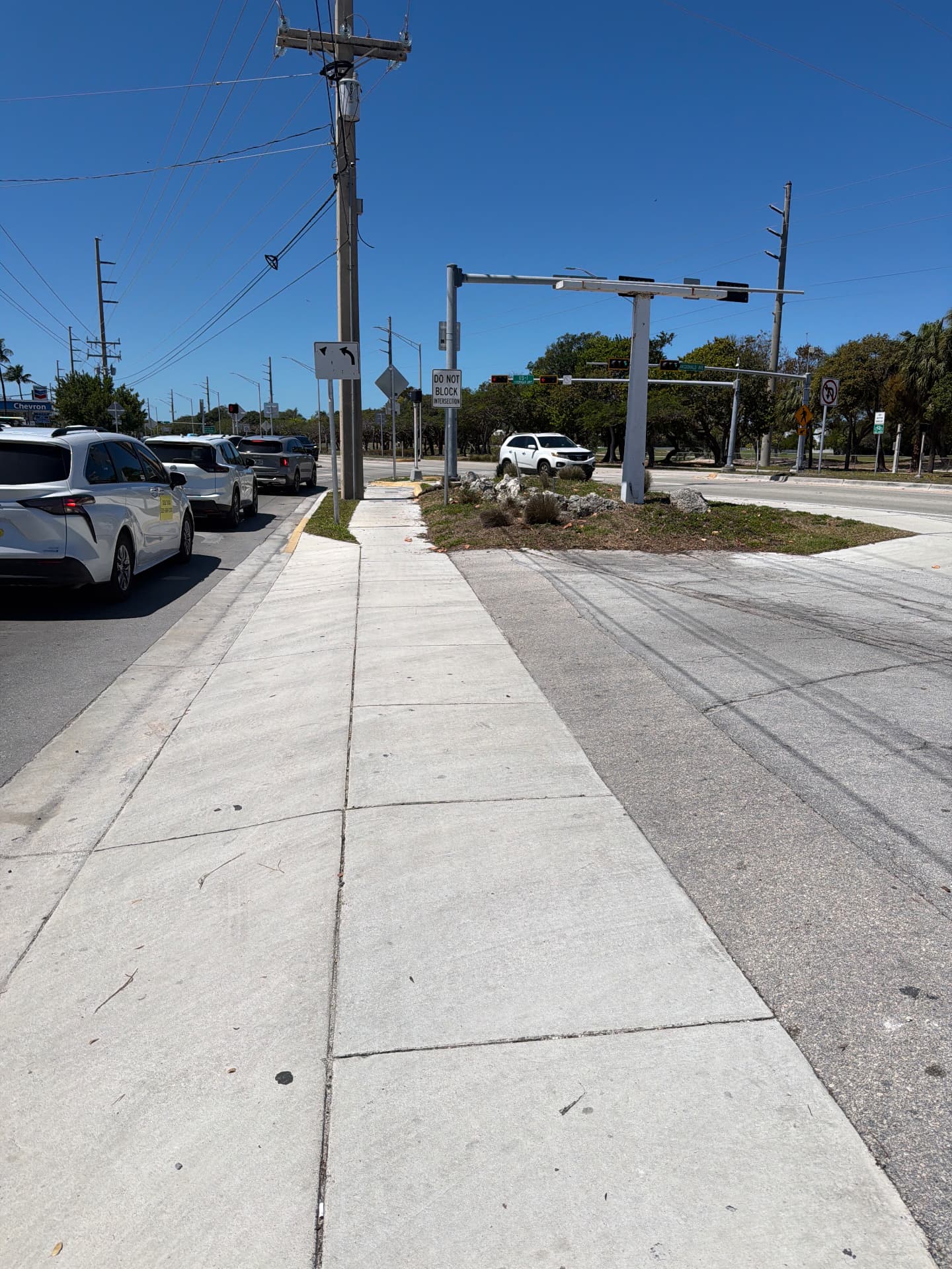 Exterior Property Care — Commercial corridor sidewalk and median maintenance
